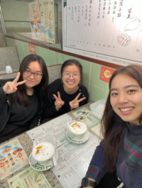 Moe (right) enjoying desserts with friends